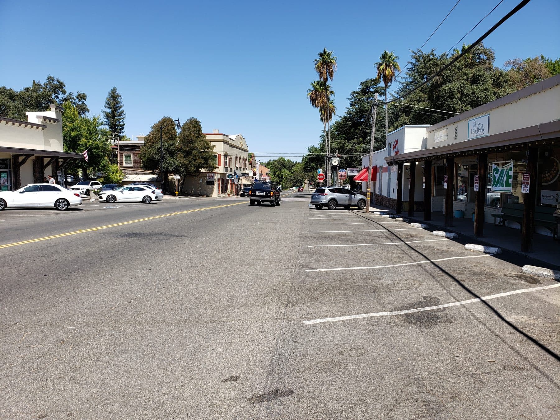 Fair Oaks Boulevard through Fair Oaks Village, the old storefronts and their wooden porch posts on the right