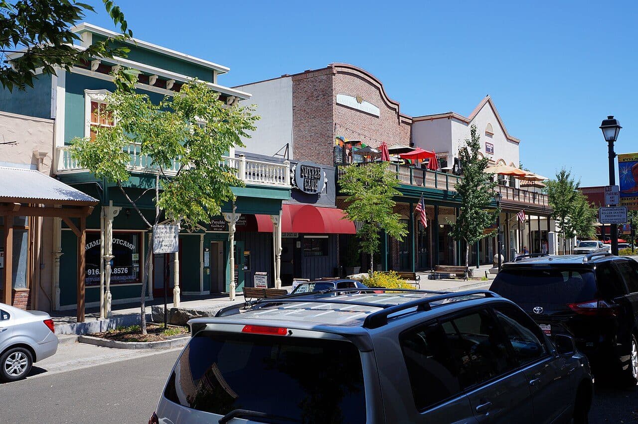 The gold-rush era storefronts and covered walkways of Sutter Street in old town Folsom