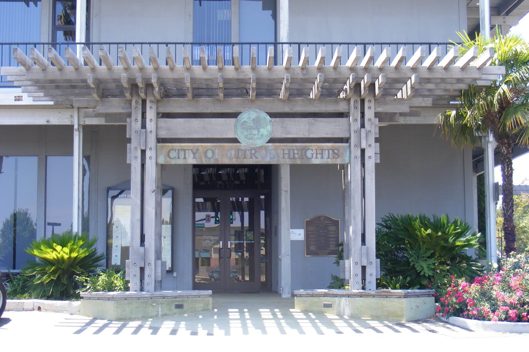 The entrance to Citrus Heights City Hall on Fountain Square Drive, the city seal above the doors